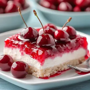 Cherry Delight dessert topped with fresh cherries and a creamy layer