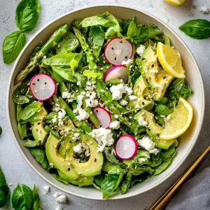 Colorful fresh spring salad with seasonal vegetables and dressing.