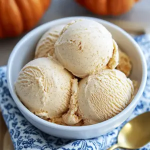 Delicious pumpkin dessert on a plate topped with whipped cream