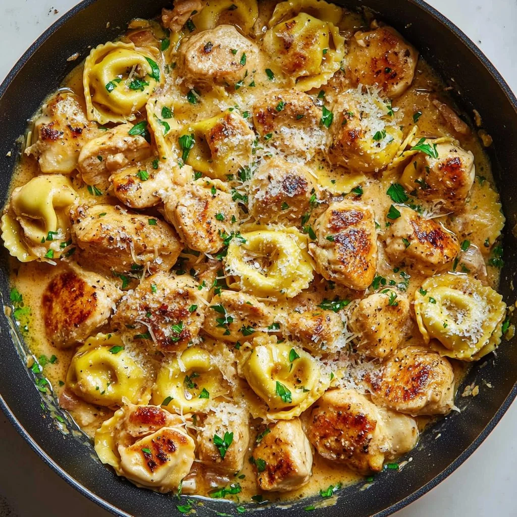 Skillet Spicy Garlic Butter Chicken Tortellini served in a vibrant dish.