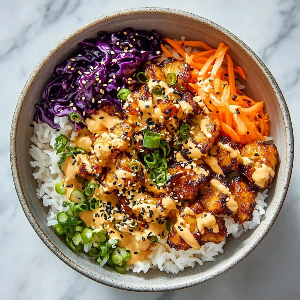 Delicious Weeknight Bang Bang Chicken Bowl served with rice and veggies